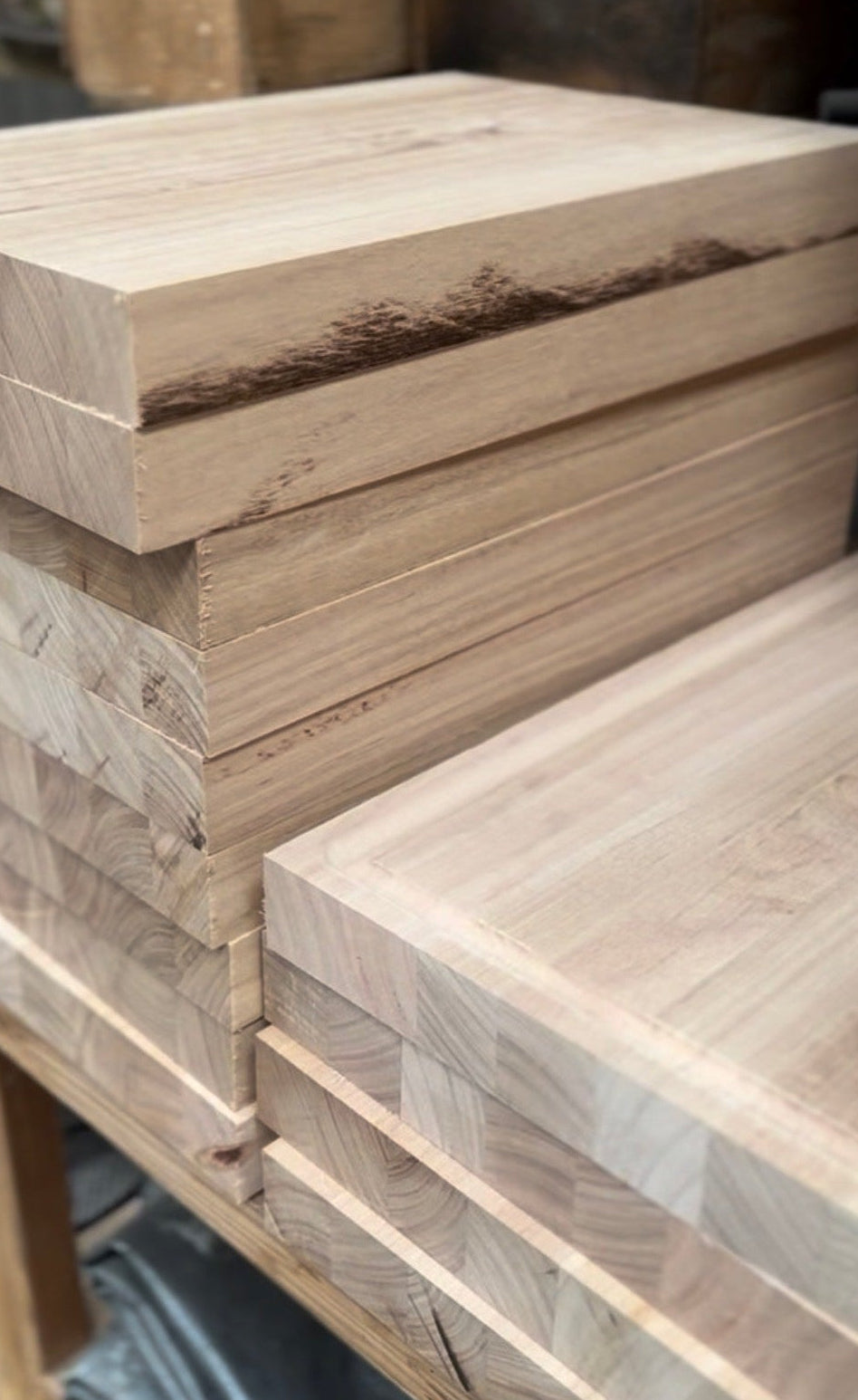 Stack of wooden boards with visible grain and texture